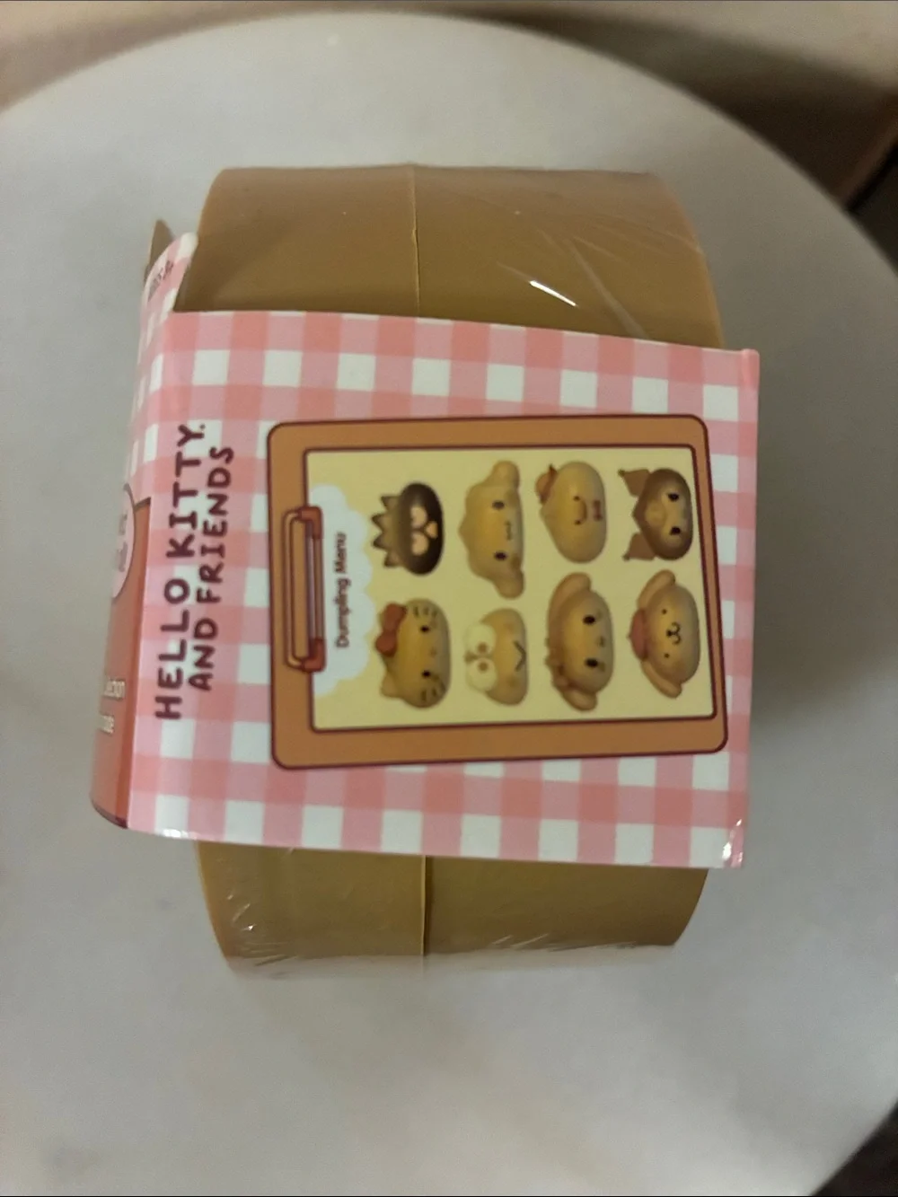 Hello Kitty and Friends Mystery Squishy Dumpling - Tan & Pink Packaging